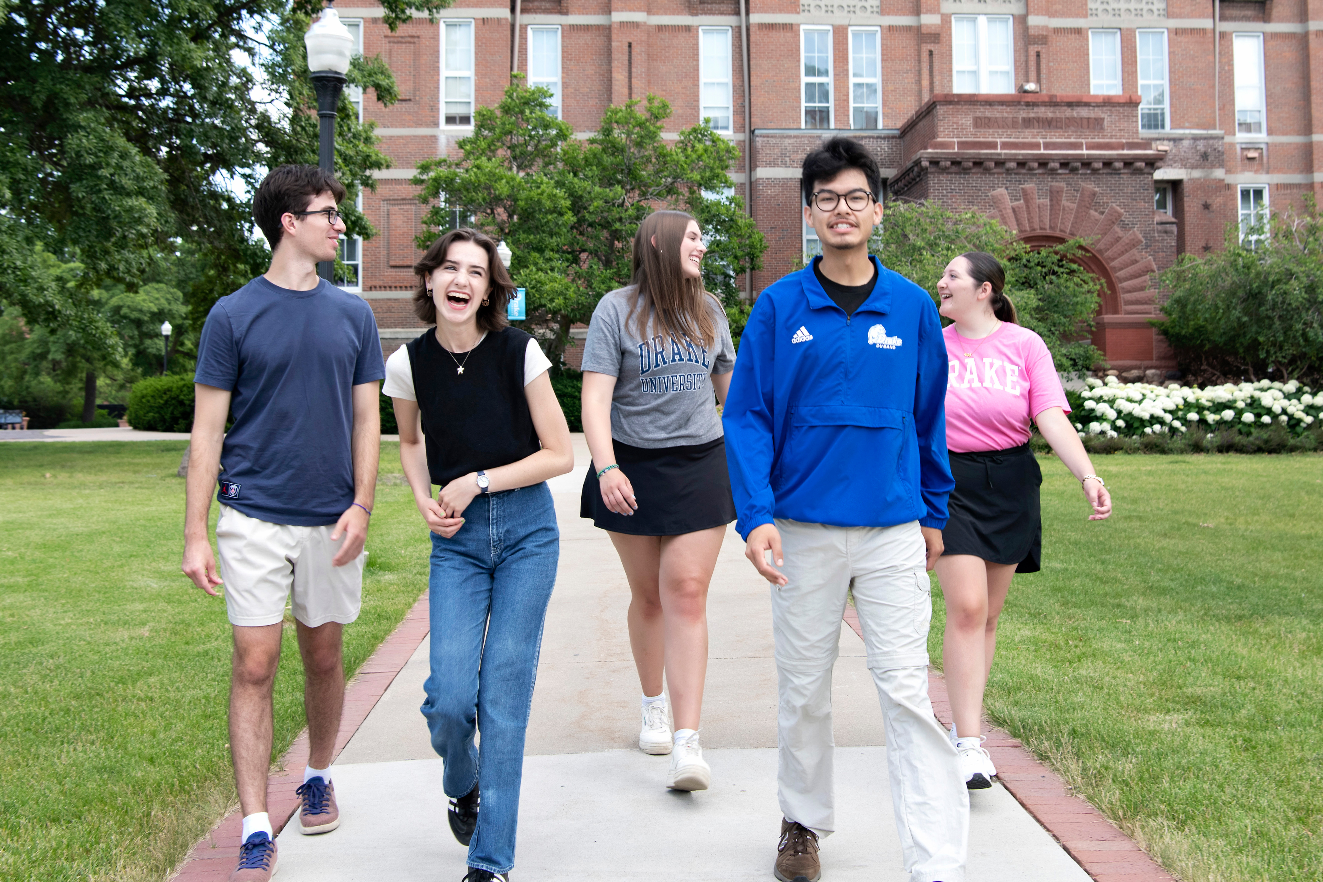 A group of students participating in the Adams Leadership Institute (ALI) go for a walk around campus
