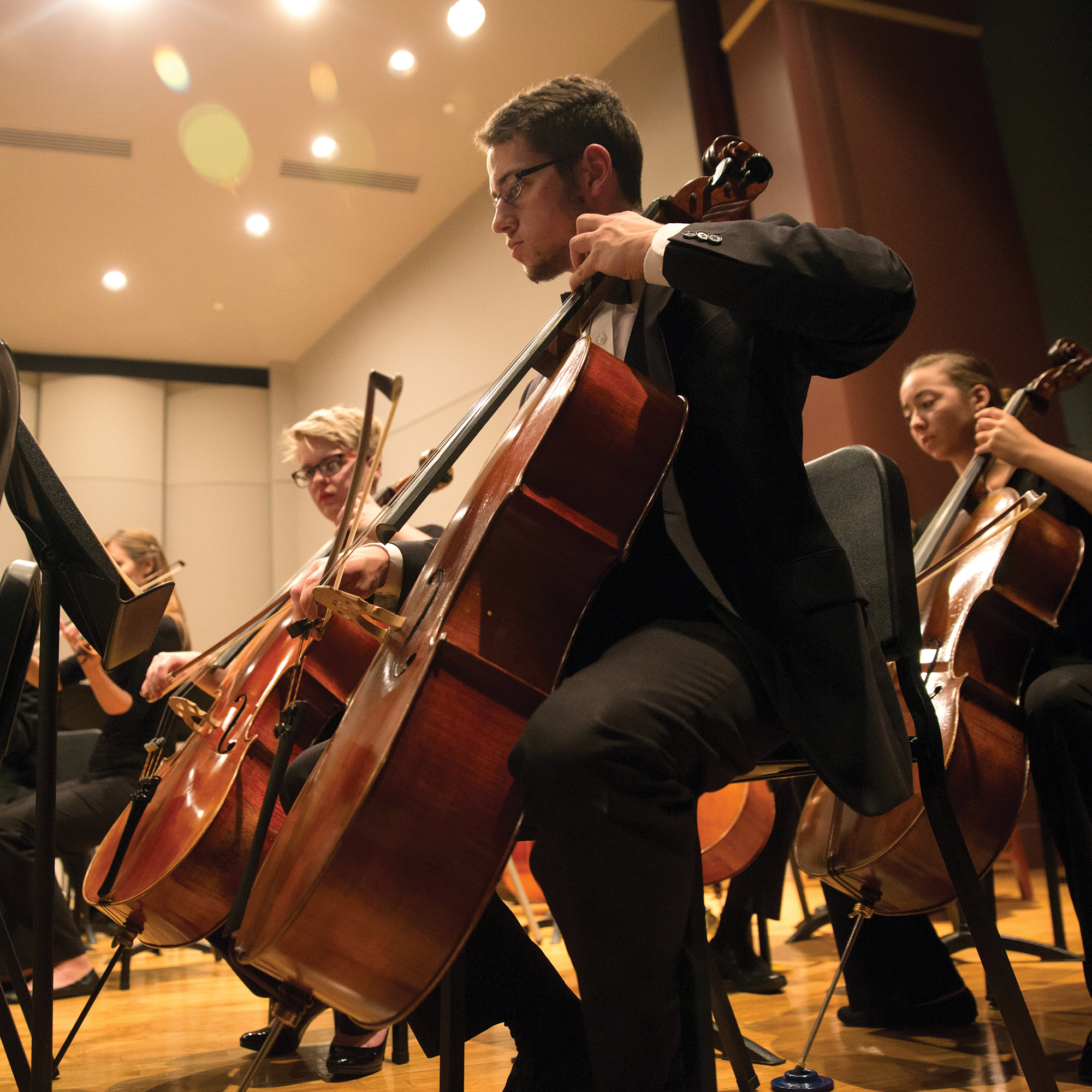 A Drake College of Arts and Sciences student performs cello during an orchestral concert