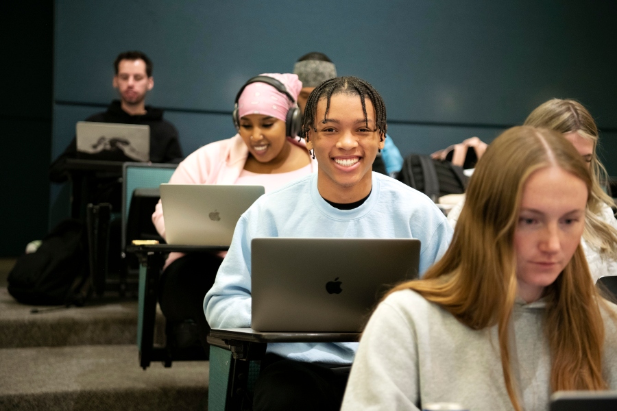 Undergraduate College of Pharmacy and Health Sciences students at Drake take notes with their laptops during an introductory class