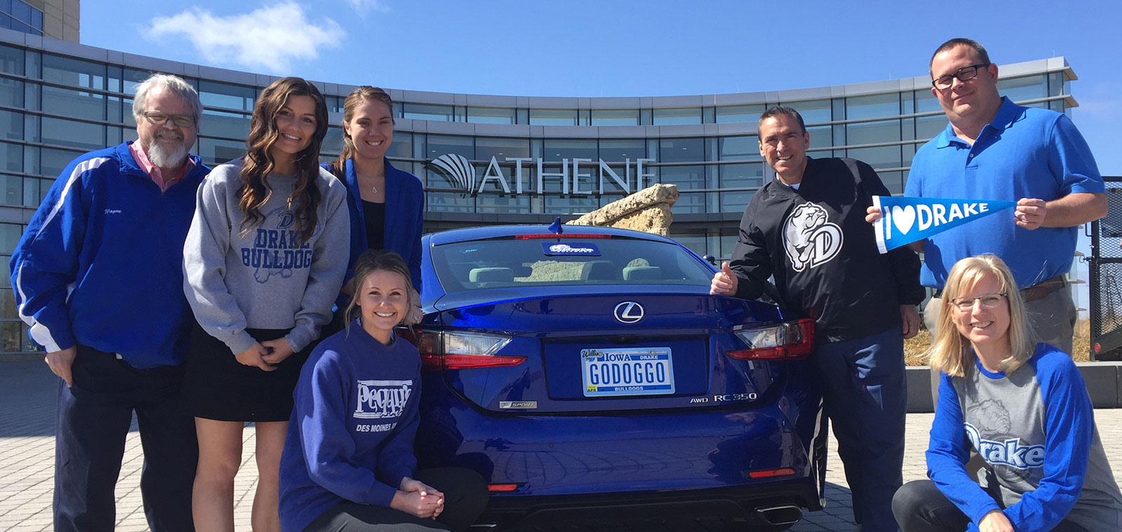 Group of Drake students standing in front of the Athene building.