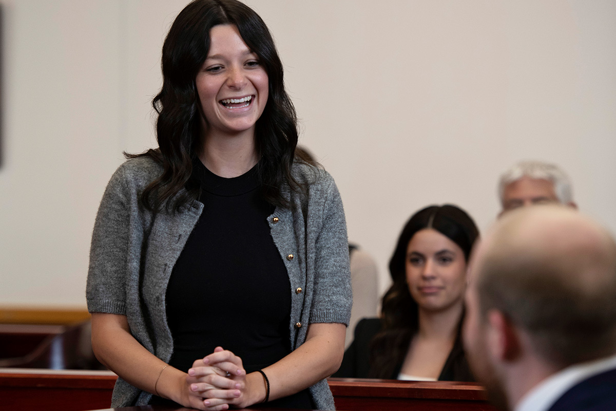 Drake University Law School Student talking with a professor in a mock courtroom.
