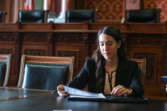 Drake Law student in the law library reading a book