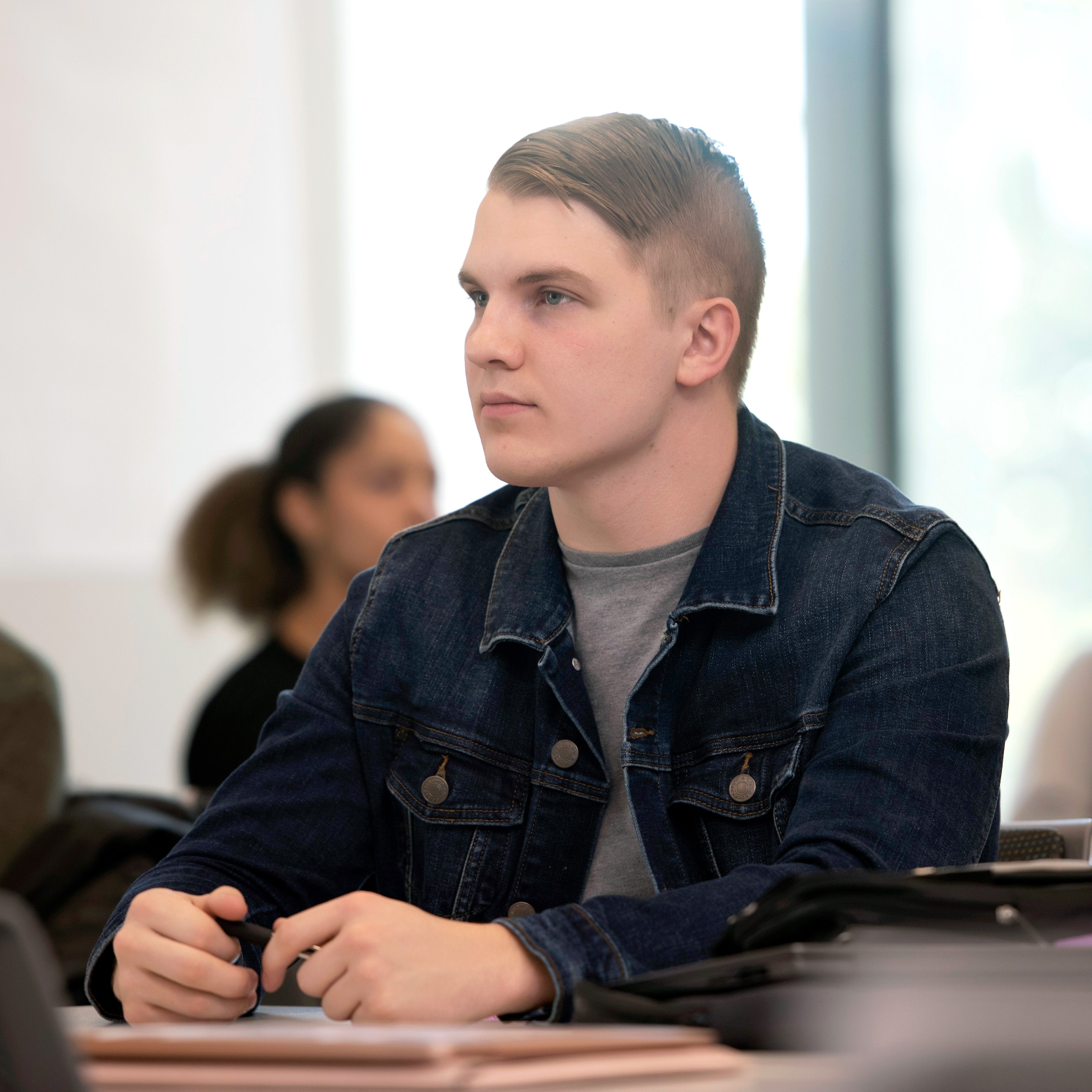 A Drake Arts and Sciences 3+3 Law student listens intensely during a lecture