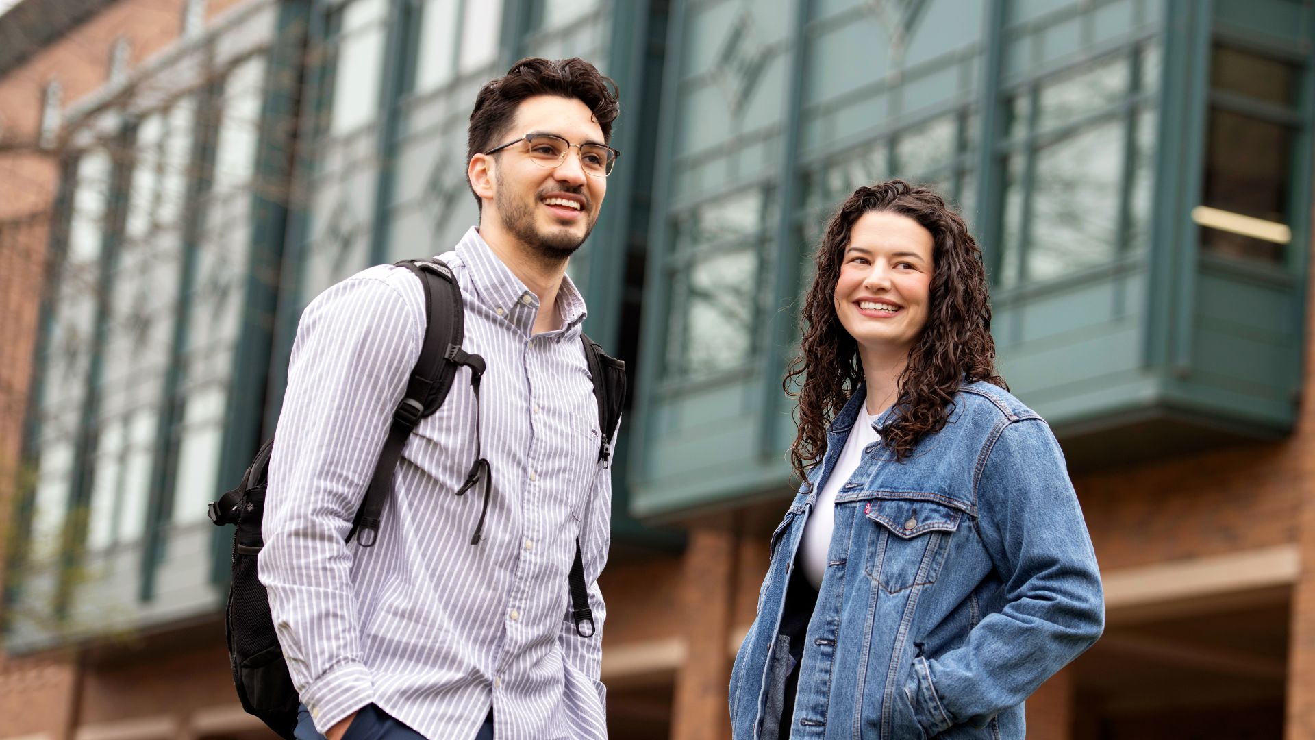 Two Drake Arts and Sciences students converse outside the Law School building before class