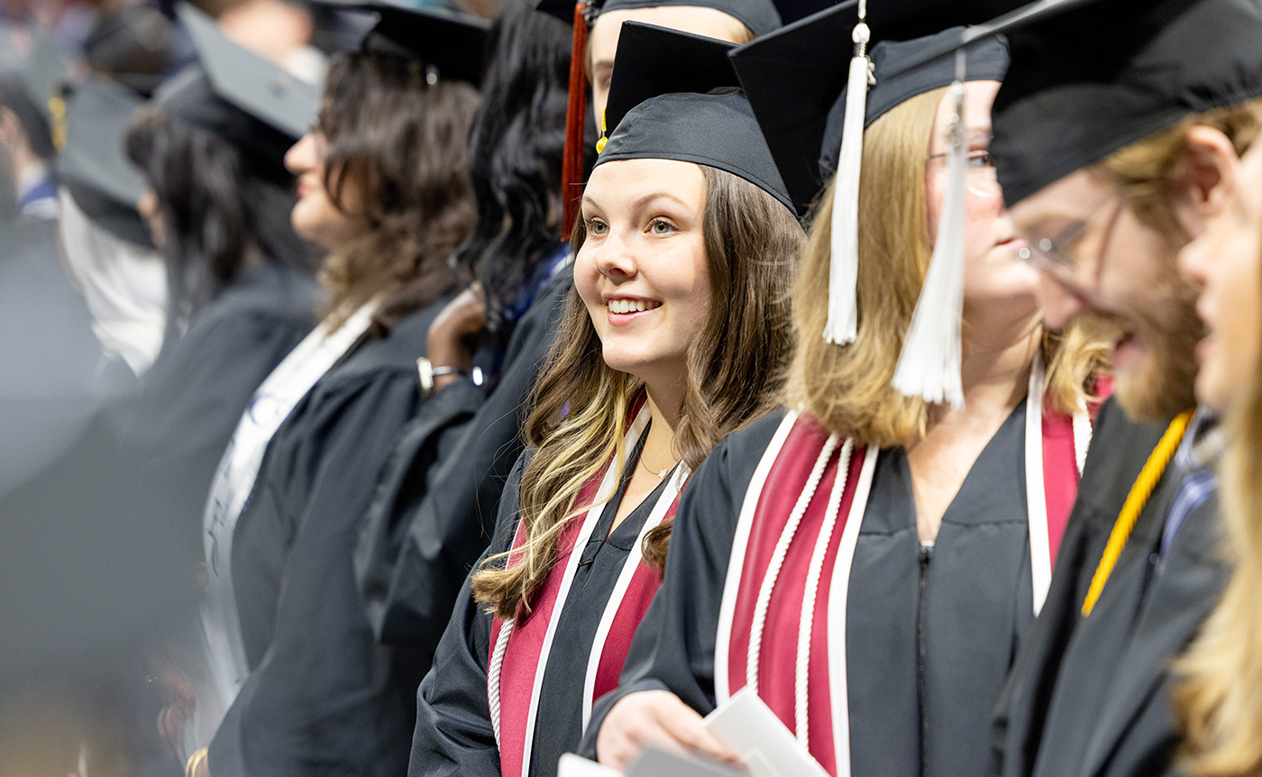 Students at a Drake University Commencement Ceremony with Honors cords on.