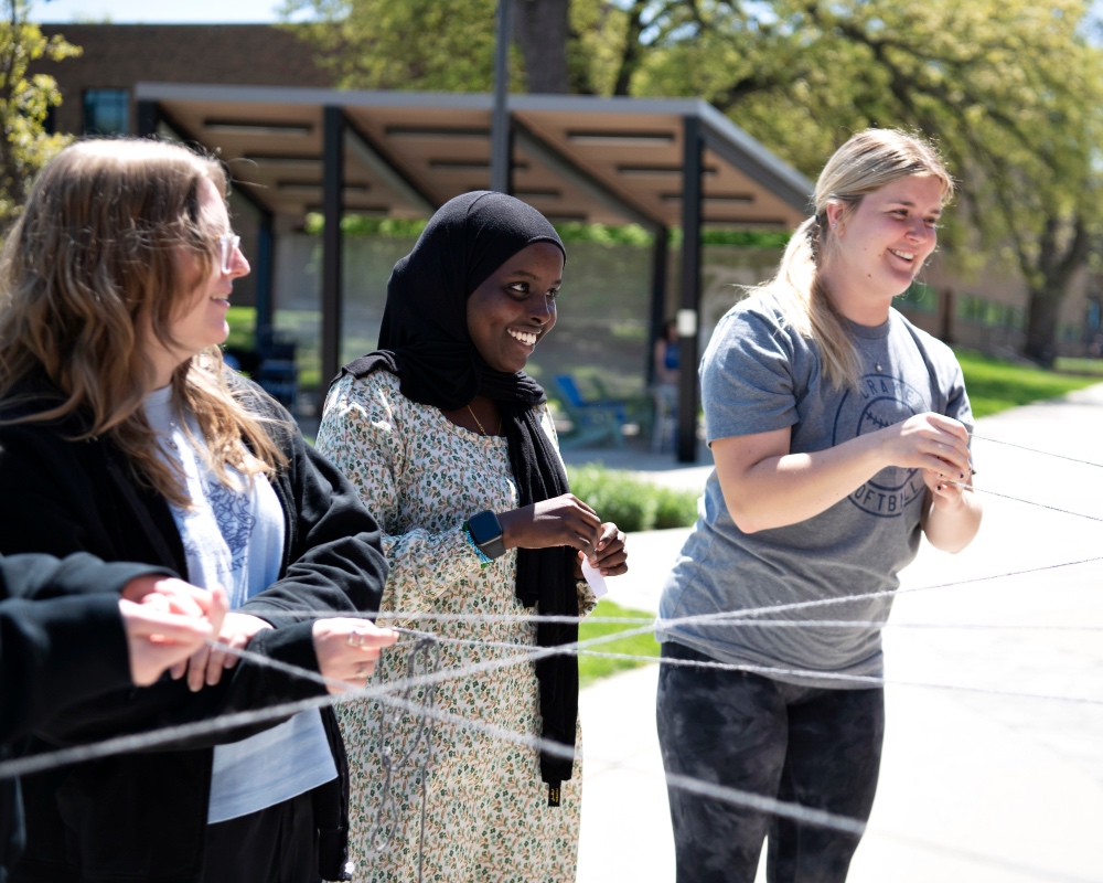 students learning about food webs outside in the sun