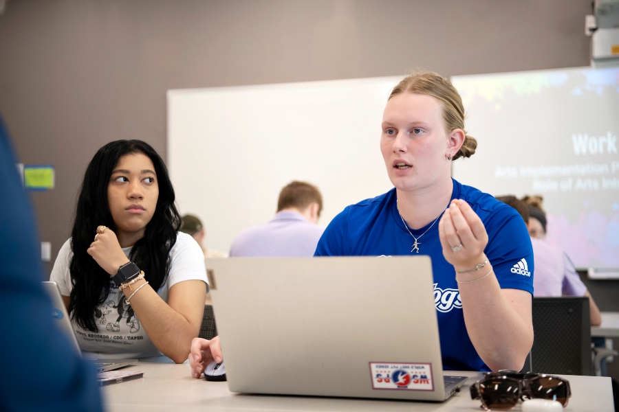 students speaking in class